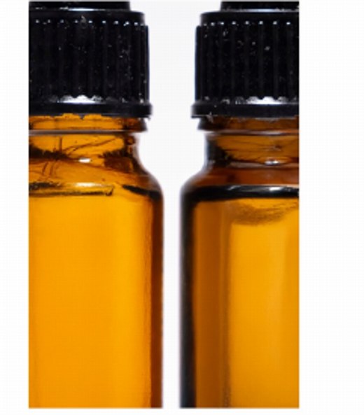 SOLAVIS product photography — amber glass bottles